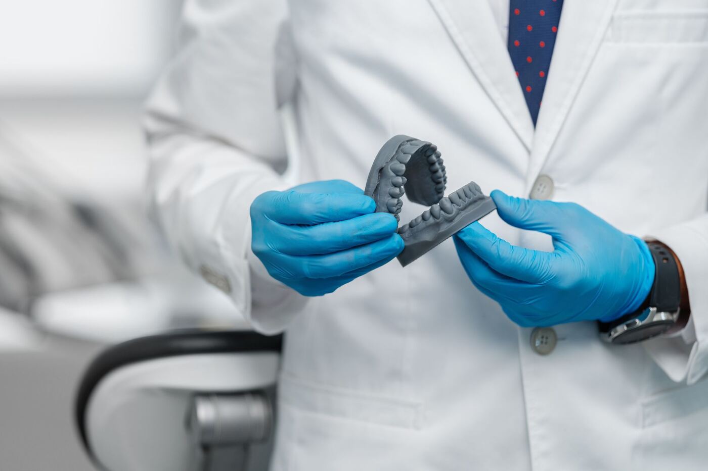 Dental technician coordinating a case over the phone with a dentist
