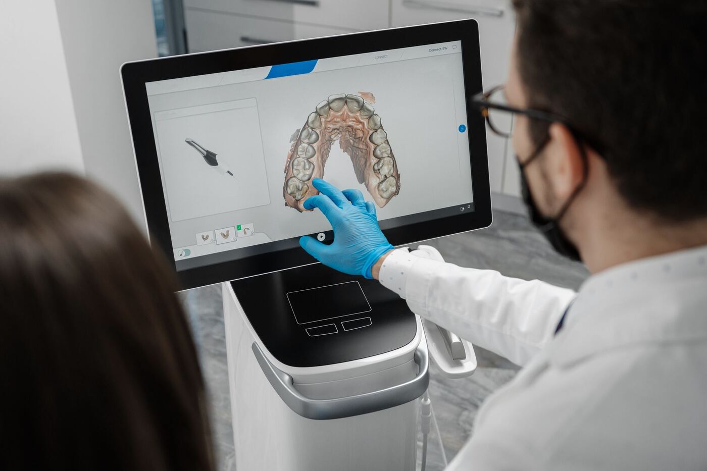 Dental lab technician fabricating a restoration